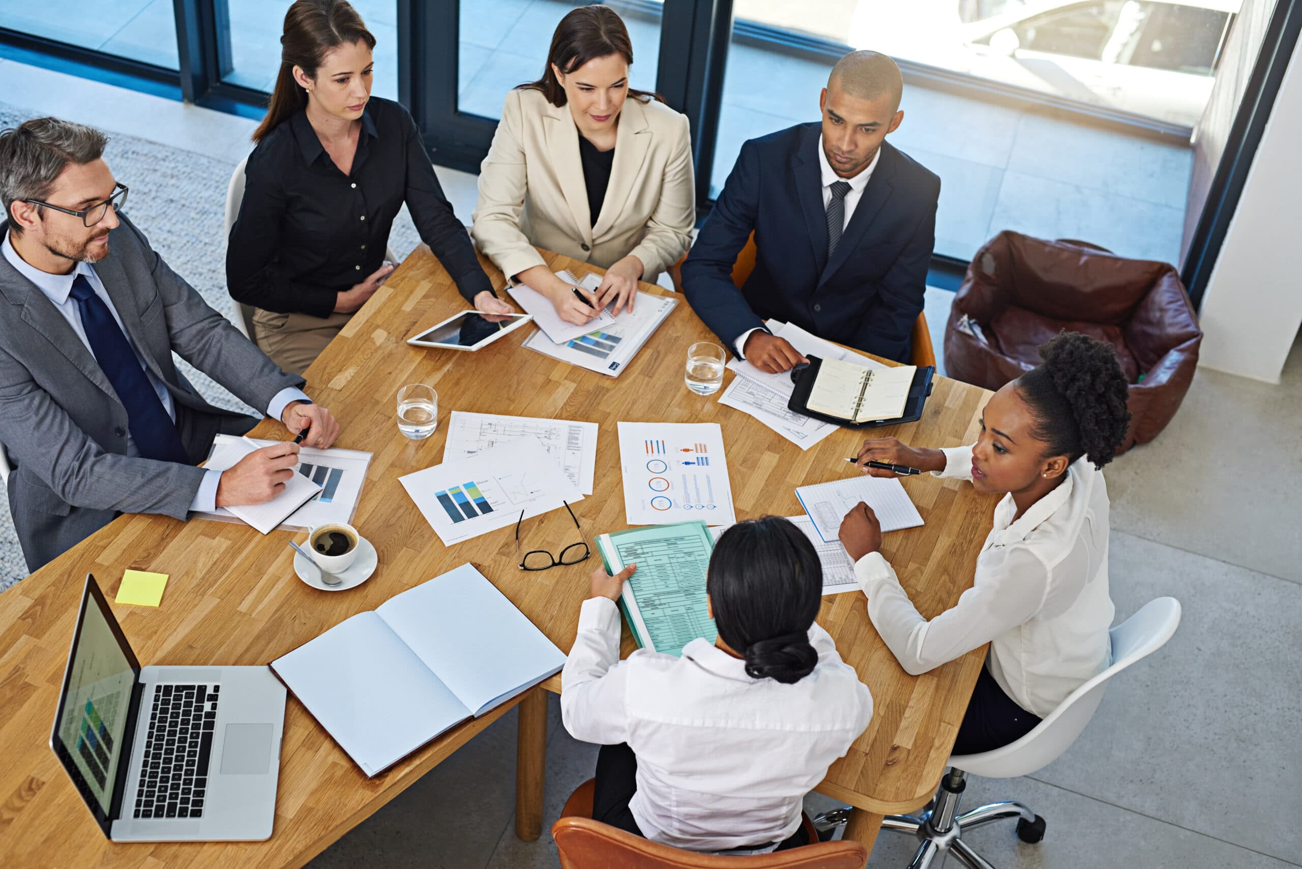 Colleagues reviewing documents in a meeting